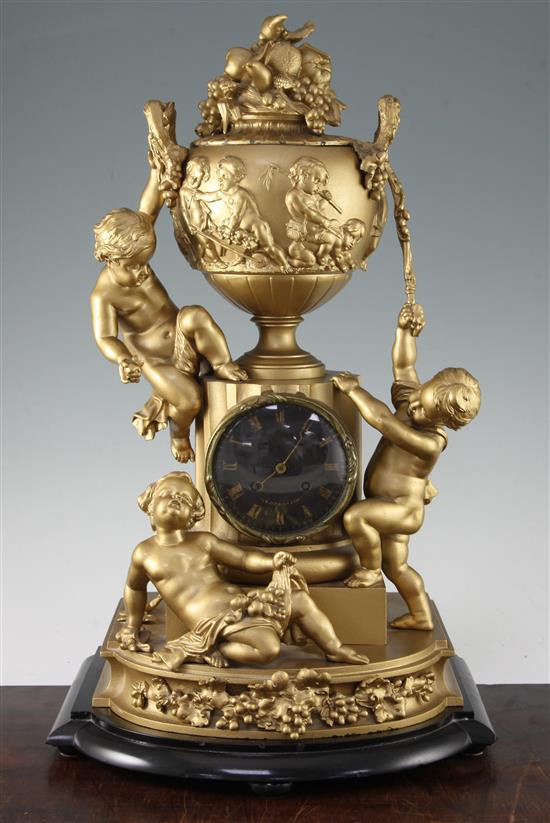 A 19th century French gold painted spelter mantel clock, 20.5in.